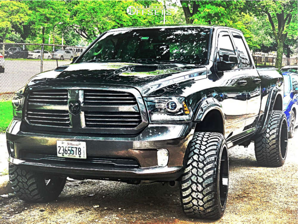 2014 Dodge Ram 1500 with 24x14 -76 Moto Metal Mo970 and 35/13.5R24 AMP Mud  Terrain Attack Mt A and Suspension Lift 6" | Custom Offsets