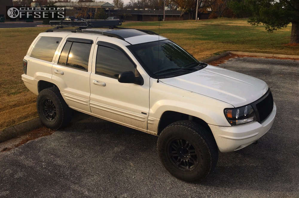 2001 Jeep Grand Cherokee with 16x8 Vision Warrior and 265/70R16 Toyo Tires  Open Country A/T III and Suspension Lift 3" | Custom Offsets