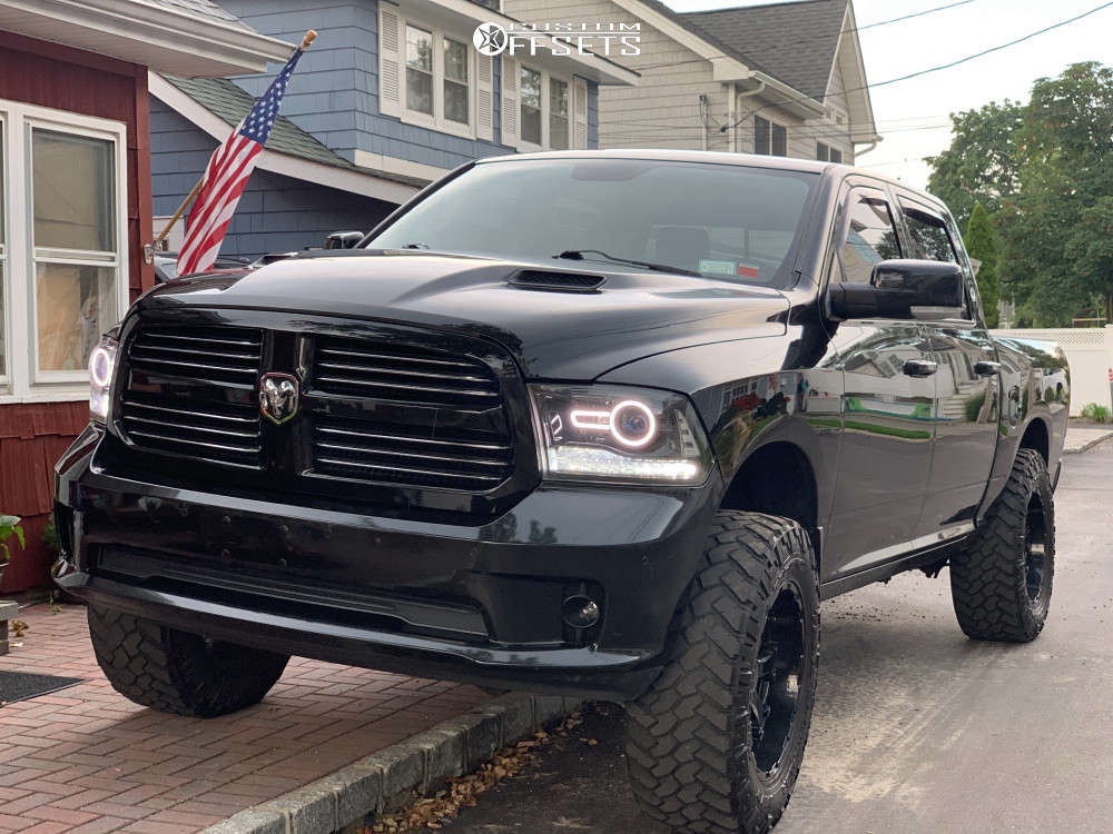 2015 Dodge Ram 1500 with 20x10 -12 Black Rhino Sierra and 37/12.5R20 Toyo  Tires Open Country M/T and Suspension Lift 4" | Custom Offsets